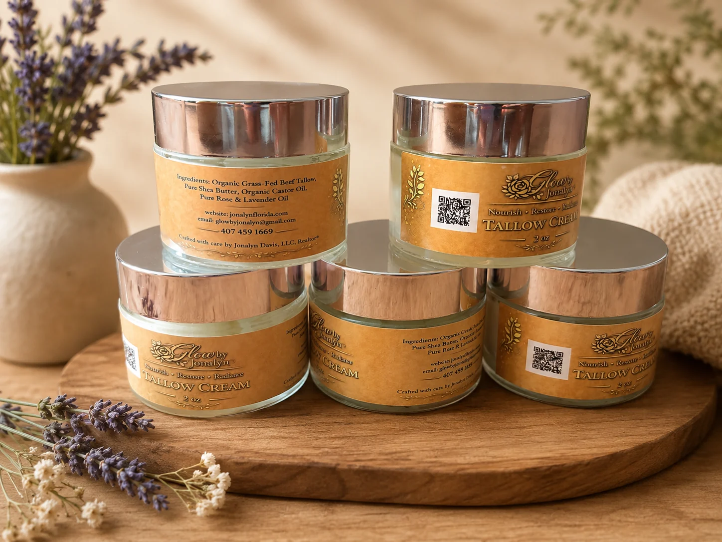 Glow by Jonalyn gold label tallow cream jars displayed with lavender